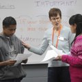 May Meredith, center, works with Wilbert Linares, left, and Maria Luisa Castaneda Ramos on Thursday ...