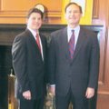 Jason B. Hendren, left, an attorney with Friday, Eldredge & Clark LLP’s Rogers office, stands next t...