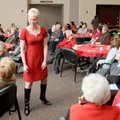 FRUGAL FASHION - Meredith Brunen models a $20 dress from Helping Hands on Saturday during the annual...