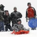 Theo Hamrin, 8, sleds down a hill at Country Club Golf Course as Shane Stewart, left, Jaylen Stewart...