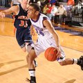 Fayetteville senior guard Taylor Cochran, right, drives past Rogers Heritage senior forward Miles Jo...