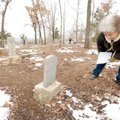 Porter Montaque of West Memphis, a former Fayetteville resident, reads the inscription Saturday on t...