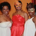 Tene Green, from left, Candice Robinson and Tiffanie Travis visit at the Crimson and Cream Ball.