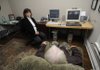 Elise Burt, a neurofeedback and biofeedback counselor at the Neurotherapy Center in Fayetteville, works with a client Monday. A HeartMath program on the computer screen graphs the rhythms of his heart.
