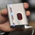 Elise Burt uses a portable device to practice the HeartMath biofeedback technique in the car or away...