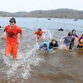 POLAR BEARS - A group emerges Saturday from the water during the 2010 Polar Bear Plunge to benefit S...