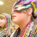 MARDI GRAS MAMBO - Jaycee Dahl, 9, left, and Katie Elam, 8, listen to music Sunday at the Mambo. The...