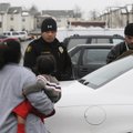 LANGUAGE AID - Springdale Police officer Gomez Zackious speaks Marshallese to a woman Thursday to ex...