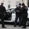 Springdale Police officer Gomez Zackious, right, speaks Marshallese to Lantir Alfonso, middle, being...