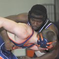 PREP WRESTLING - Fayetteville’s Devin Bowers, right, wrestles with Rogers Heritage’s Conor Bolton du...