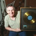Dale Hawkins displays his gold record for the song 