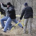 Bentonville Police officers and Benton County Sheriff Office deputies lead someone away from a crime...