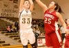Bentonville’s Whitney Sandmann, left, goes for a lay up shot guarded by Springdale High’s Jasmine Gilyard on Feb. 16 in Bentonville.