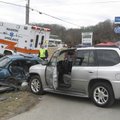 FATAL WRECK - Bella Vista Fire Chief Steve Sims looks over the scene of a two-vehicle accident that ...
