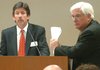 Kim Arnall (left), assistant director of Legislative Research for Fiscal Affairs, and Richard Weiss, director of the state Department of Finance and Administration, field questions Wednesday during a Joint Budget Committee meeting at the state Capitol.