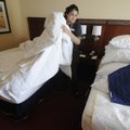 Karla Rodriguez changes the bedding Wednesday at the Marriott Courtyard Fayetteville. The hotel off...