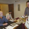  Glen Andrews talks with Mikki Seay, right, after she bought a copy of the book, “An Impossible Cast...