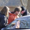  Two officers with the Benton County Sheriff’s Office arrest Nicholas Johansen in connection with ca...