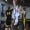  Pea Ridge’s Kip Kelly shoots a layup over Prairie Grove defenders Nathan Eilerts, left, and Tanner ...