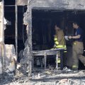 Bentonville firefighters investigate a house fire Thursday at 1110 N.W. “G” St. in Bentonville.
