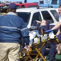 Central EMS and Fayetteville Fire Department personnel load Fayetteville High School student Robbie ...