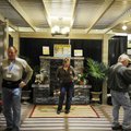  Dee Williams, center, looks over the display Friday presented by Backyard Designs, as her husband, ...