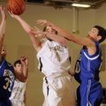 Bentonville Gold’s Austin Haggard shoots over Rogers High’s 
Trevor Hampton in the first half of Th...