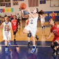 Springdale Central’s Ashley Gray, center, goes up for a shot past Fayetteville Ramay’s Caylea Moore,...