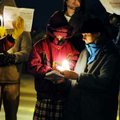  Mary, right, and Rosemary Sulzen light a candle during the 40 Days for Life kick-off rally Tuesday ...
