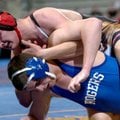  Searcy’s Aaron Sweet tries to turn Rogers High’s Sam Reift during their match Friday at the Arkansa...