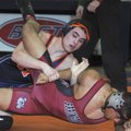 Rogers Heritage’s Jared Arthur takes down Springdale High’s Albertson Claros on Saturday during the ...