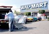 A customer loads his vehicle outside a Wal-Mart store in Mexico City in this file photo.

