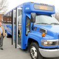  Bentonville Mayor Bob McCaslin prepares to board an Ozark Regional Transit bus Saturday at Fire Sta...
