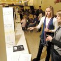  Caroline Little, 16, a sophomore at Fayetteville High School, center, explains her science fair pro...