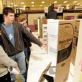  James Harter, a 15-year-old sophomore at Fayetteville High School, center, explains his science fai...