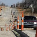  Traffic travels on a reduced Wagon Wheel Road on Thursday in Springdale. The road is the last to be...