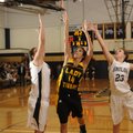 Prairie Grove’s Julie Rutherford, right, shoots as Shiloh senior post Kami Garrison defends during t...