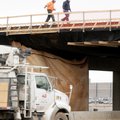 Work continues Friday on the Interstate 540 overpass where Olive Street in Rogers meets Southwest 28...