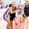 Bentonville sophomore Brittany Reagan, center, takes the baton from sophomore Kelsey Wheelhouse, rig...