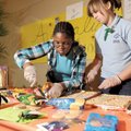 THINKING DAY - Karla Banks, left, and Katherine Magoulick, both 13-year-old Girl Scouts from Troop 5...