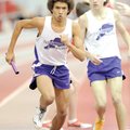 Fayetteville’s Tevin Whitney, left, takes the baton from John Gibson while anchoring the 3,200-meter...