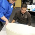Financial aid worker Darcy Williams from Northwest Arkansas Community College helps Diego Araujo fro...