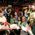 WORLD THINKING DAY - Kayla Main, an 11-year-old Girl Scout from Troop 5355 in Springdale, left, hand...