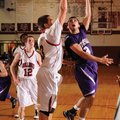 Fayetteville’s Kikko Haydar, right, shoots over Springdale High’s Shelton Baird in the second half o...
