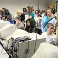 Students from high schools around Northwest Arkansas crowd into one of three Rogers High School clas...