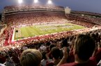 The stands at Reynolds Razorback Stadium are packed for a 2004 Razorbacks home football game. Ticket prices for conference games are going up this 2010 season, the university has announced.