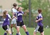 Fayetteville sophomore forward Anne Mitchell, front, heads the ball in front of Bentonville sophomore defender Margaret Power in the fist half of the 7A state soccer championship Friday at Razorback Field in Fayetteville. The Lady Bulldogs lost 2-0.
