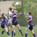 Fayetteville sophomore forward Anne Mitchell, front, heads the ball in front of Bentonville sophomor...