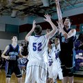 Fayetteville Woodland’s Tyler McCullough shoots over Springdale George’s Josiah Wymer during second-...