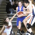 Rogers High’s Natalie Scott, center, keeps possession of the ball as Springdale Southwest defenders ...